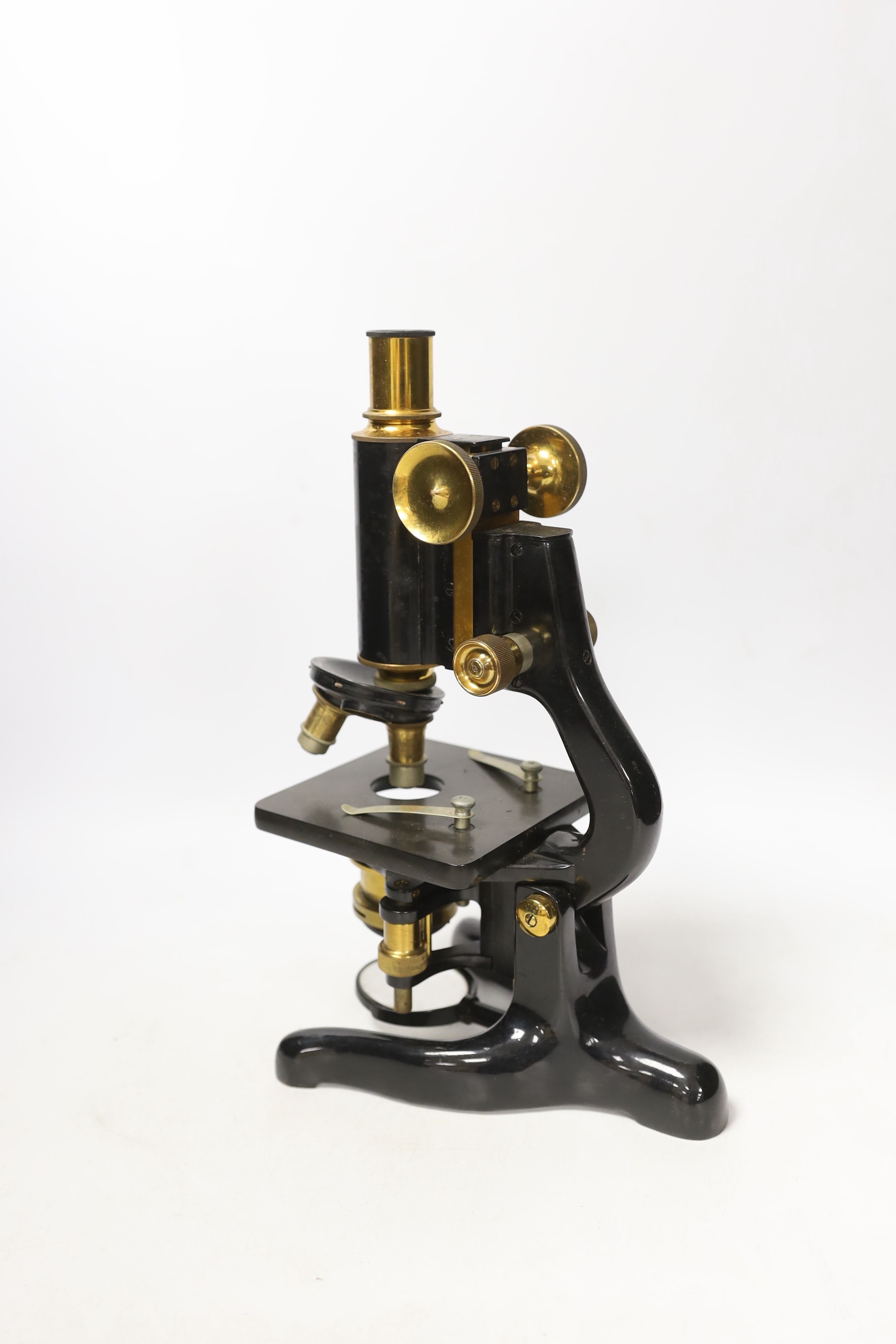 A mahogany cased 'service' microscope, marked W. Watson & Son Ltd., London and numbered 34429, with alternative lens in fitted compartments, case 34cm high